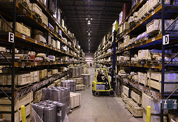 Forklift Moving Around Warehouse