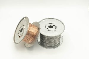 Spools of silver and bronze wire