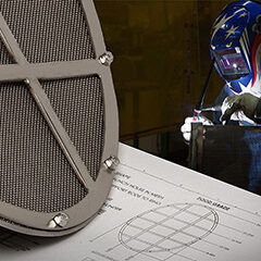 Part-and-drwg-with-welder-in-background